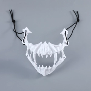 Close-up of white skeletal tiger mask with sharp fangs and elastic straps for cosplay