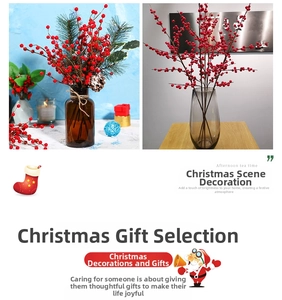 Detail of Christmas red berry branch with pine needles and cones in a glass vase