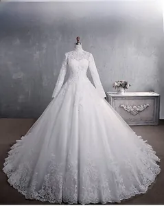 Detailed close-up of intricate lace embroidery and beads on bridal gown sleeves