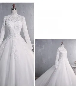 Detailed close-up of intricate lace patterns and high neck collar on a long sleeve bridal gown
