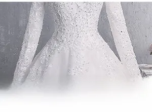 Close-up of white lace embroidery and delicate sequins on the long-sleeved wedding gown