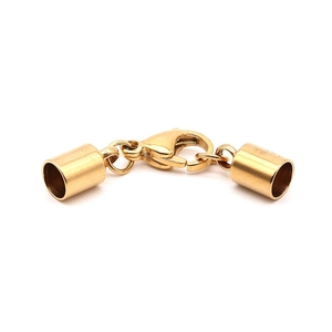 Close-up of golden stainless steel lobster clasp and end caps for DIY jewelry making
