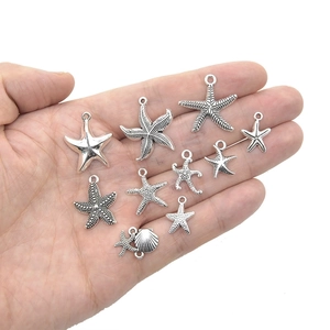 Collection of antique silver alloy starfish and shell charms for DIY jewelry making