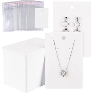 Blank white jewelry display cards with clear self-seal bags for necklaces and earrings