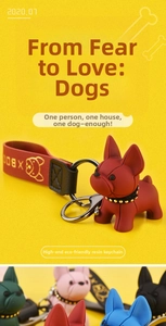 Detail of red French Bulldog resin keychain with multi-color collection display