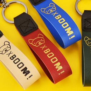 Colorful leather XBOOM bear keychains in beige, red, blue, and green for women bags