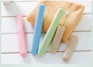 Macro detail of portable wheat straw toothbrush cases in four pastel candy colors