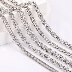 Polished stainless steel jewelry chains in various styles like cable and rope chain