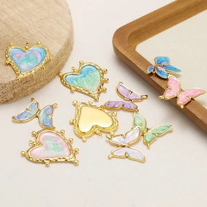 Golden butterfly and heart charms with colorful enamel drip for DIY jewelry making
