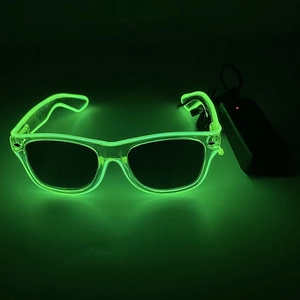Detail of green LED glowing glasses with external battery pack for party decoration