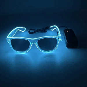 Macro shot of ice blue LED glowing glasses with external battery pack controller in the dark