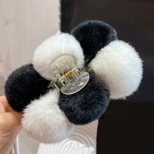 Furry black and white rabbit fur hair claw clip with six plush pom poms for women