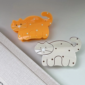 Cute acetate cat hair claws in orange and cream white for elegant hairstyling