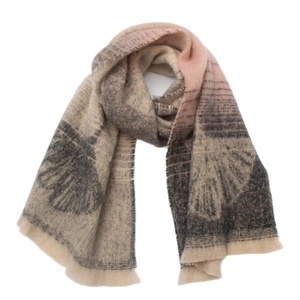 Macro detail of soft pink and grey jacquard scarf with ginkgo leaf pattern and fringe edges