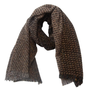 Detailed view of brown houndstooth woven scarf featuring fringed edges and soft texture