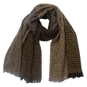 Detail of multi-color plaid knit scarf with herringbone weave and fringe trim ends