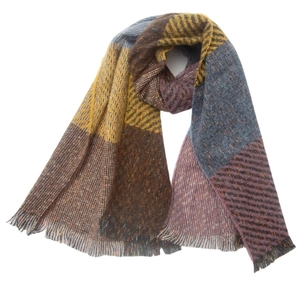 Close-up of multicolor plaid scarf with twill weave texture and long fringe details