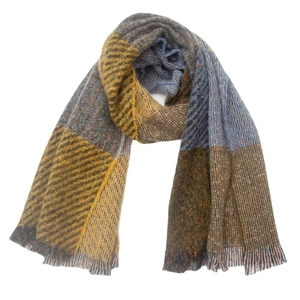Detail of multi-color plaid scarf with mustard yellow, blue, and brown tassels