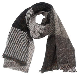 Detail of plaid scarf featuring dark grey and beige herringbone weave with soft tassels