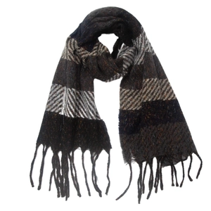 Close-up of winter scarf showing striped herringbone pattern and soft tassel fringe detail