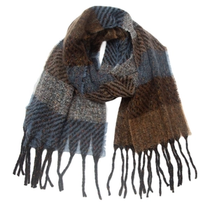 Detailed view of winter striped scarf showing tweed texture and fringe tassels