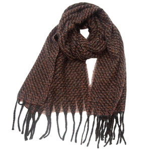 Detail of orange and black woven scarf with decorative tassels and knit texture