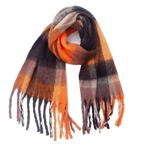 Close-up of thick plaid scarf featuring orange and grey checkered wool with fringe edges