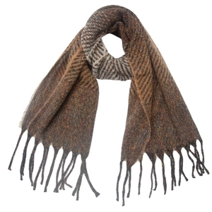 Detail of brown wool blend scarf with herringbone pattern knit and tassel edges