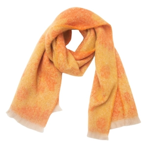Close-up of orange and yellow gradient knit scarf with subtle circular pattern and fringes