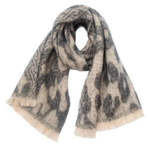 Macro detail of leopard print scarf with soft gray-beige texture and fringe tassels