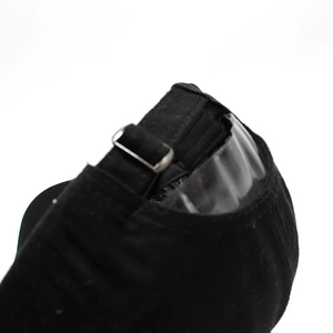 Detail of black baseball cap showing the adjustable metal buckle and rear cotton strap