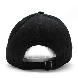 Detail of black cotton baseball cap showing breathable eyelets and adjustable metal buckle