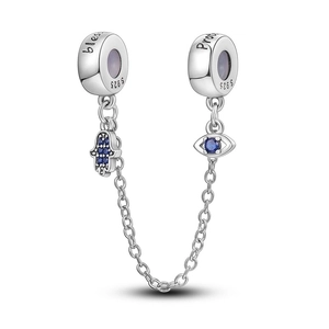 Macro view of S925 silver safety chain bead with evil eye and hand of fatima charms
