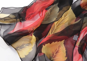 Macro detail of leaf pattern on lightweight chiffon scarf with fine hemmed edges
