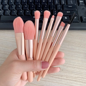 Close-up of 8-piece mini pink makeup brush set with soft bristles and rose gold ferrules