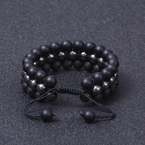 Three-layer beaded bracelet featuring volcanic lava stone and matte onyx with adjustable cord