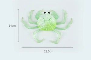 Detailed size view of a green crab toy showing dimensions 22.5cm width and 14cm height