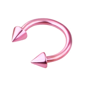 Detailed macro view of pink horseshoe nose ring with sharp cone spikes on both ends