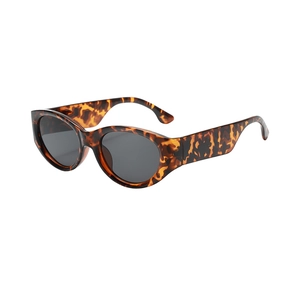 Retro tortoise shell oval sunglasses with thick wide temples and dark lenses
