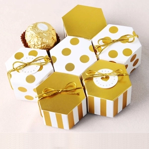 Mini hexagonal white and gold gift box with ribbon and polka dot stripe pattern