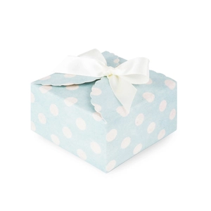 Detail of light blue polka dot gift box featuring a decorative white ribbon bow