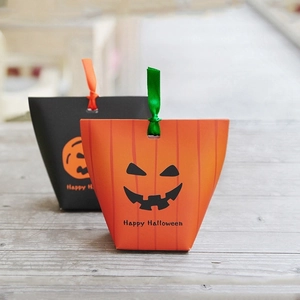Halloween gift boxes featuring pumpkin and ghost patterns with silk ribbon handles