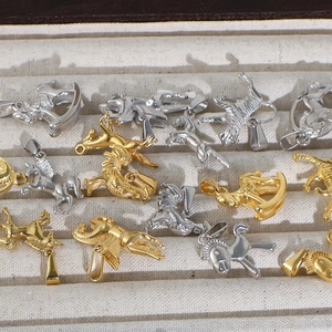 Golden and silver stainless steel animal pendants in a jewelry display box