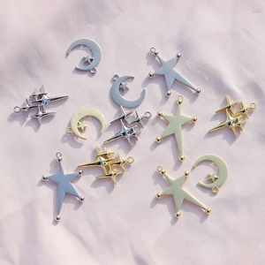 Golden and silver alloy star and moon charms on pink silk for DIY jewelry making