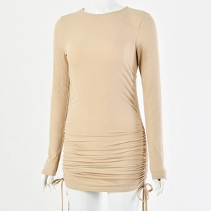 Detail of long sleeve knit dress featuring adjustable side drawstrings and ribbed texture