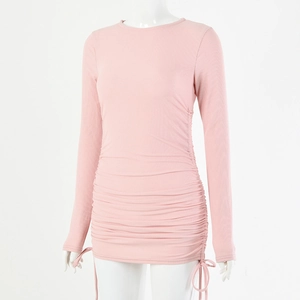 Detail of pink ribbed cotton dress featuring adjustable drawstring ruching on the side