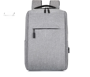Front detail of grey business laptop backpack showing hidden zipper and side USB port