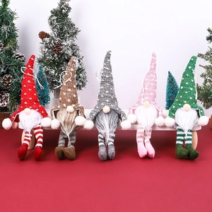 Set of 5 plush Christmas gnomes with colorful polka dot hats and striped legs