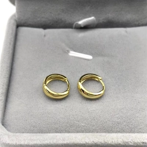 Pair of minimalist S925 sterling silver hoop earrings in gold finish on velvet box