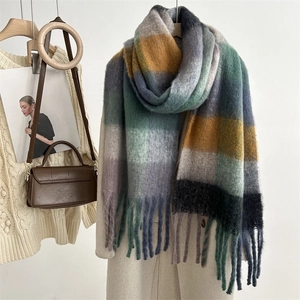 Plaid mohair scarf with colorful pastel checks and long tassels for a warm winter look